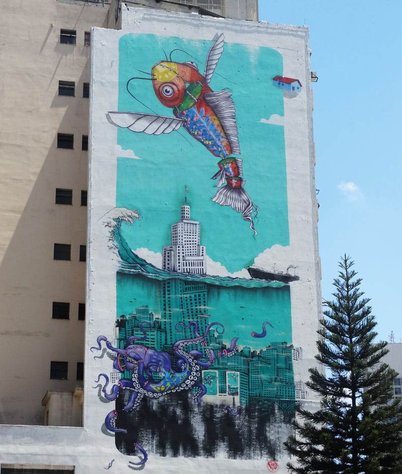 Grafite "Polvo e torre do Banespa submersos e peixe alado com céu" (2015), por Binho Ribeiro.
