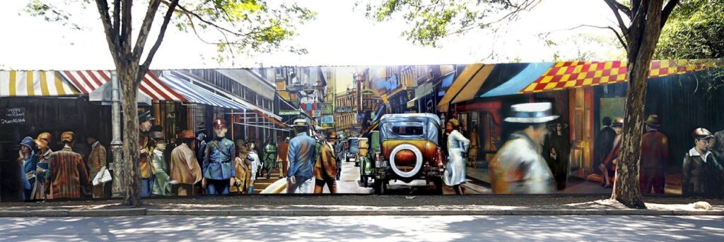 Muro das Memórias: mural pintado com cores como amarelo, vermelho, verde, bege, branco, azul, cinza, marrom, dentre outras, para captar o resgate ao passado de São Paulo.