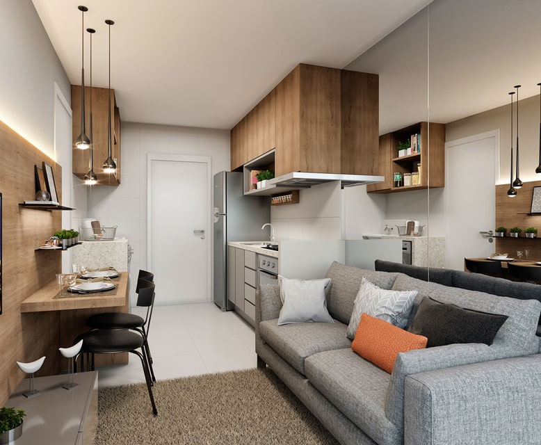 Apartamento com cozinha e sala integrados. Conta com espaço para bancadas e mesa para 2 lugares.