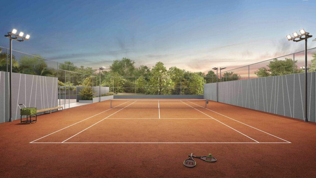  quadra de tênis do Garden Haus Porsche Consulting possui piso de saibro e refletores para que a prática do esporte possa ser exercida a qualquer hora do dia.